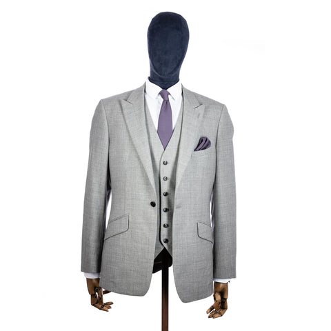 Blue Lilac Knitted tie and pocket square with grey suit on a mannequin - centre
