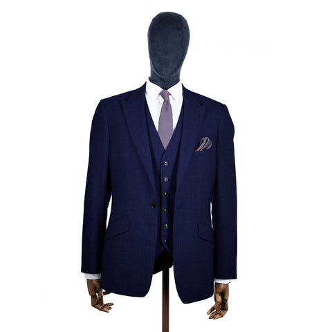 Blue Lilac Knitted tie and pocket square with navy suit on a mannequin - centre