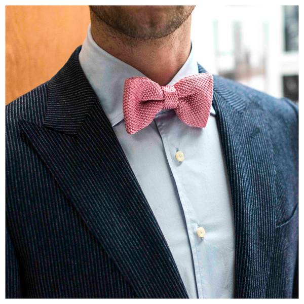 Plain blue shirt and pink knitted bow tie