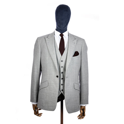 Brown Knitted tie and pocket square with grey suit on a mannequin - centre