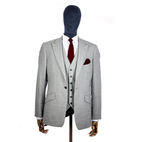 Burgundy Knitted tie and pocket square with grey suit on a mannequin - centre