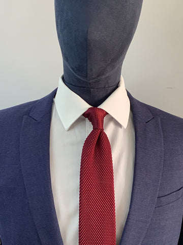 Burgundy knitted tie and navy suit