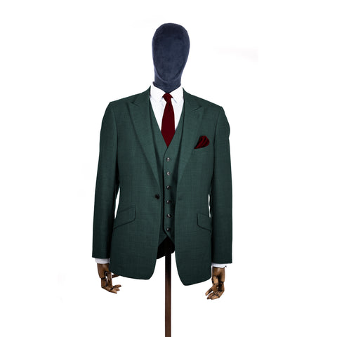 Burgundy knitted tie and pocket square with green suit on a mannequin-BroniandBo