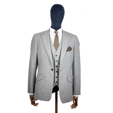 Champagne Knitted tie and pocket square with grey suit on a mannequin - centre