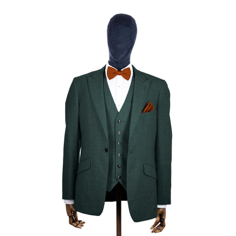 Copper knitted bow tie and pocket square with green suit on a mannequin-BroniandBo