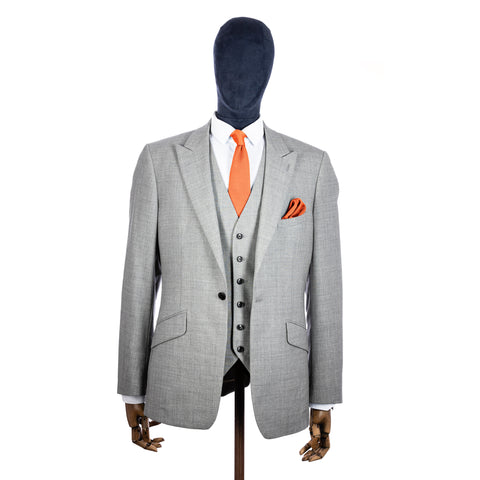 Coral Fusion Knitted tie and pocket square with grey suit on a mannequin - centre