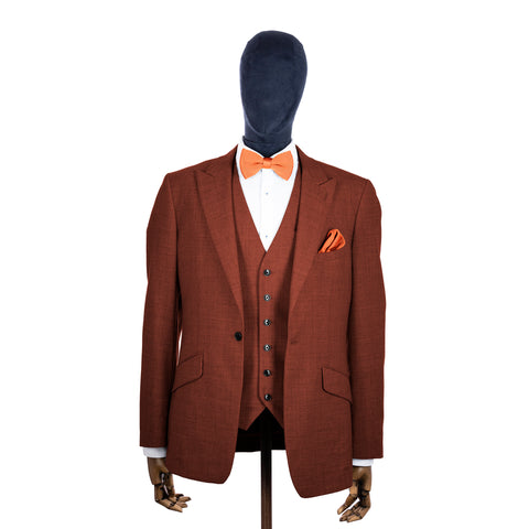 Coral Fusion knitted bow tie and pocket square with rust suit on a mannequin-BroniandBo