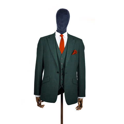 Dark Burnt Orange knitted tie and pocket square with green suit on a mannequin-BroniandBo