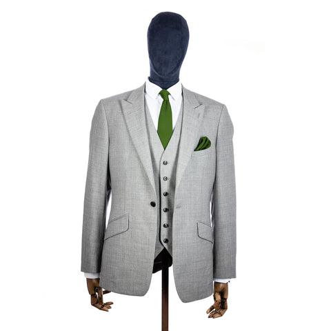 Dark Olive Green Knitted tie and pocket square with grey suit on a mannequin - centre