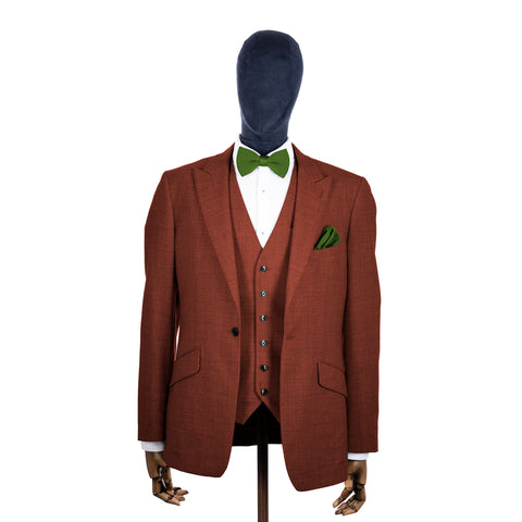 Dark Olive Green knitted bow tie and pocket square with rust suit on a mannequin-BroniandBo