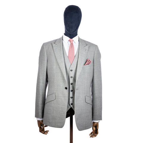 Dusty Pink Knitted tie and pocket square with grey suit on a mannequin - centre