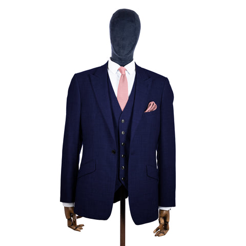 Dusty Pink Knitted tie and pocket square with navy suit on a mannequin - centre