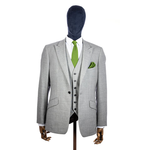 Emerald Green  Knitted tie and pocket square with grey suit on a mannequin - centre.jpg