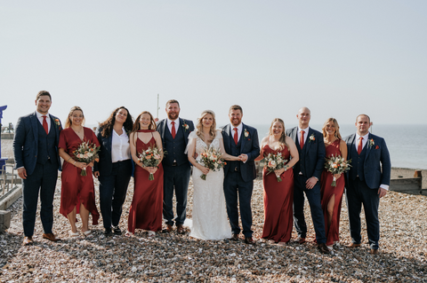 Dark burnt orange bridesmaid dresses and matching knitted ties