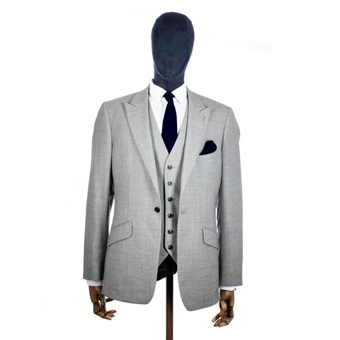 Ink Blue Knitted tie and pocket square with grey suit on a mannequin - centre