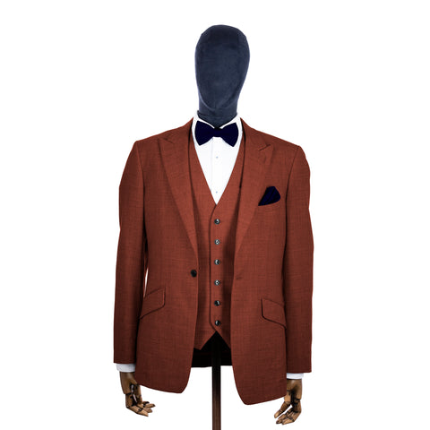 Ink Blue knitted bow tie and pocket square with rust suit on a mannequin-BroniandBo