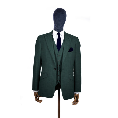 Ink Blue knitted tie and pocket square with green suit on a mannequin-BroniandBo