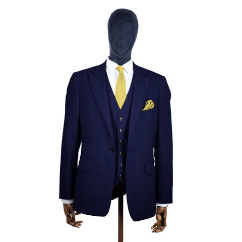 Mellow Yellow Knitted tie and pocket square with navy suit on a mannequin - centre