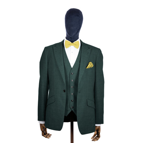 Mellow Yellow knitted bow tie and pocket square with green suit on a mannequin-BroniandBo