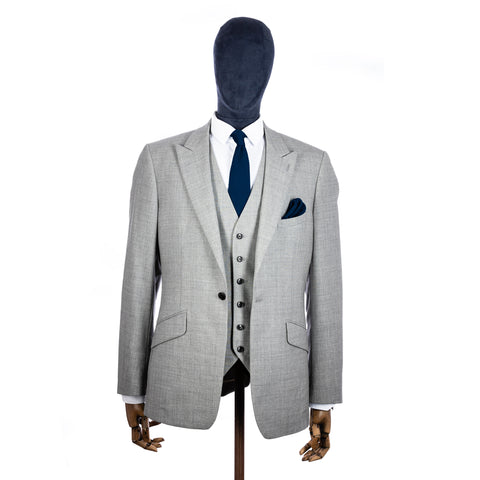 Midnight Blue Knitted tie and pocket square with grey suit on a mannequin - centre