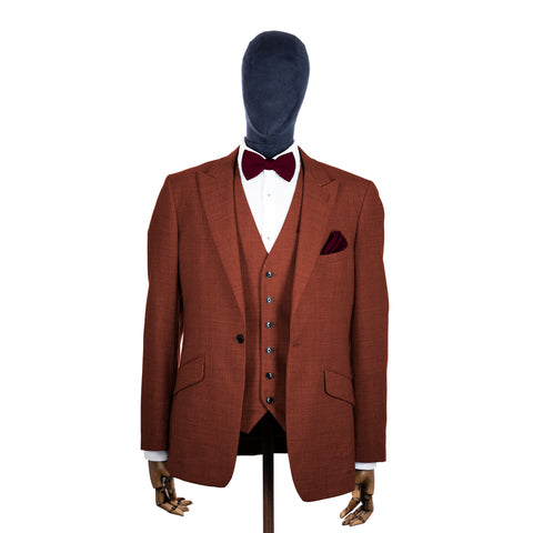 Mulberry knitted bow tie and pocket square with rust suit on a mannequin-BroniandBo