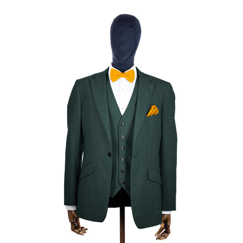 Mustard Yellow knitted bow tie and pocket square with green suit on a mannequin-BroniandBo