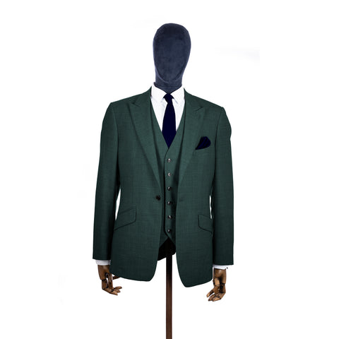 Navy Blue knitted tie and pocket square with green suit on a mannequin-BroniandBo