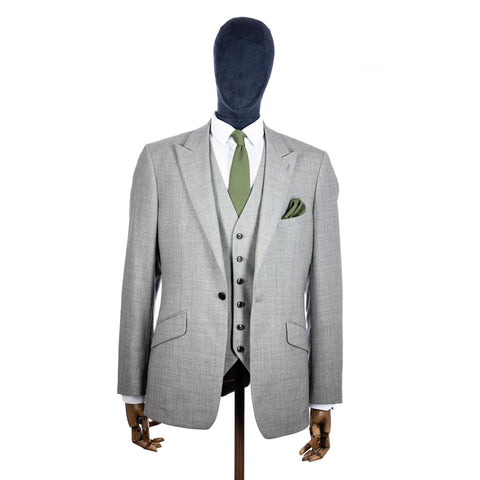 Olive Green Knitted tie and pocket square with grey suit on a mannequin - centre