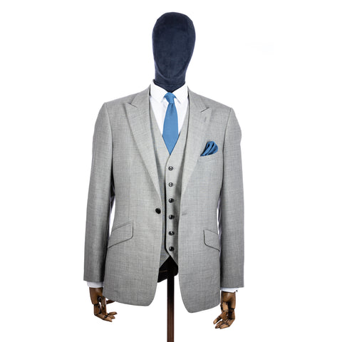 Pastel Blue Knitted tie and pocket square with grey suit on a mannequin - centre