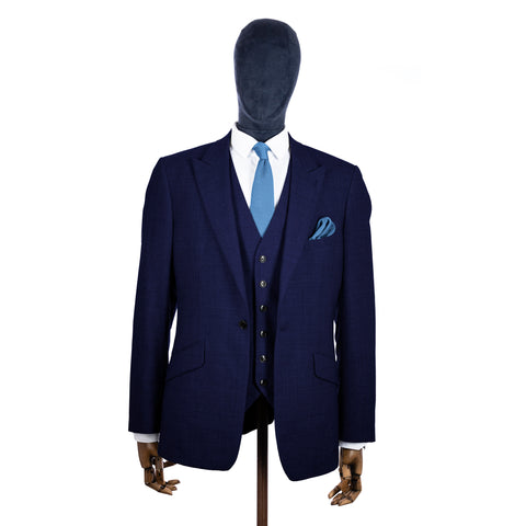 Pastel Blue Knitted tie and pocket square with navy suit on a mannequin - centre