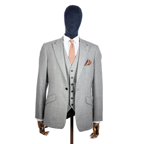 Rose Quartz Knitted tie and pocket square with grey suit on a mannequin - centre