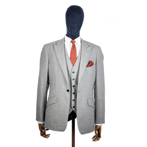 Rustic Orange Knitted tie and pocket square with grey suit on a mannequin - centre