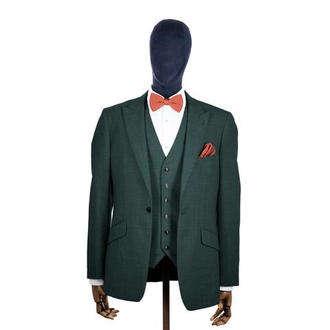 Rustic Orange knitted bow tie and pocket square with green suit on a mannequin-BroniandBo