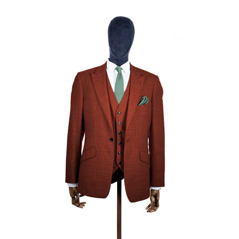 Sage Green knitted tie and pocket square with rust suit on a mannequin-BroniandBo