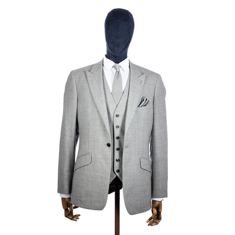 Silver Knitted tie and pocket square with grey suit on a mannequin - centre