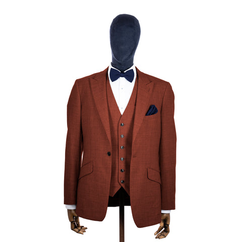 Stone Blue knitted bow tie and pocket square with rust suit on a mannequin-BroniandBo