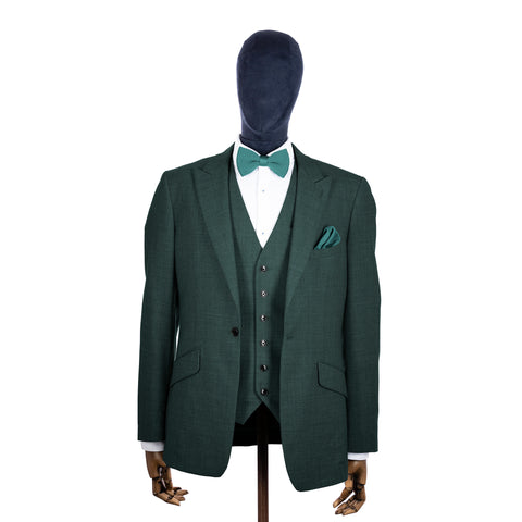 Teal knitted bow tie and pocket square with green suit on a mannequin-BroniandBo