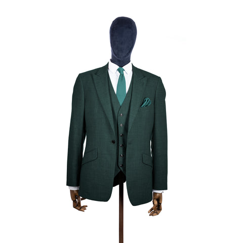 Teal knitted tie and pocket square with green suit on a mannequin-BroniandBo