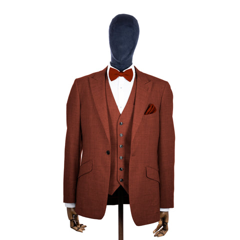 Terracota knitted bow tie and pocket square with rust suit on a mannequin-BroniandBo