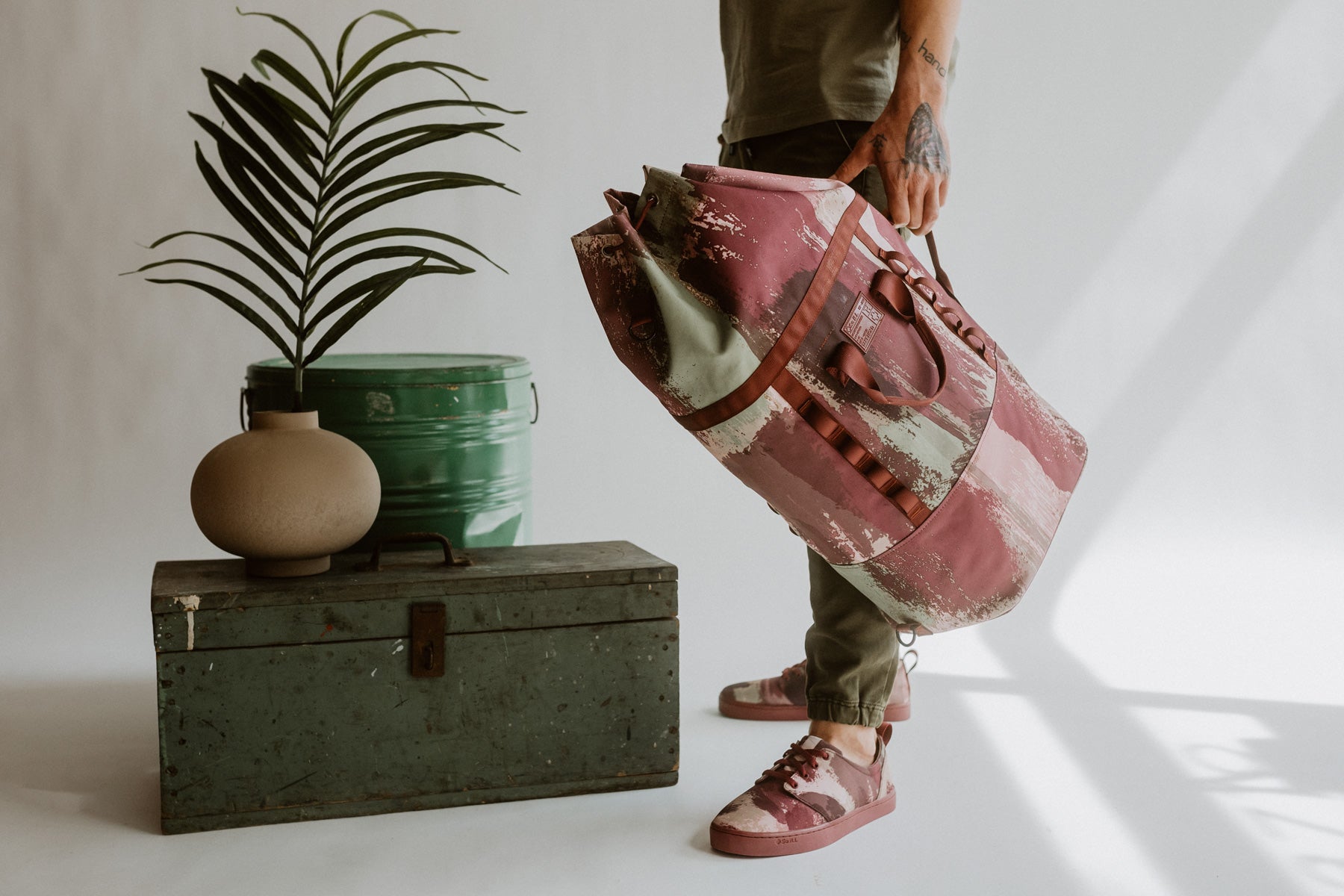 So iLL x On The Roam eco camo mini dirt bag is shown in a studio setting with a grey background
