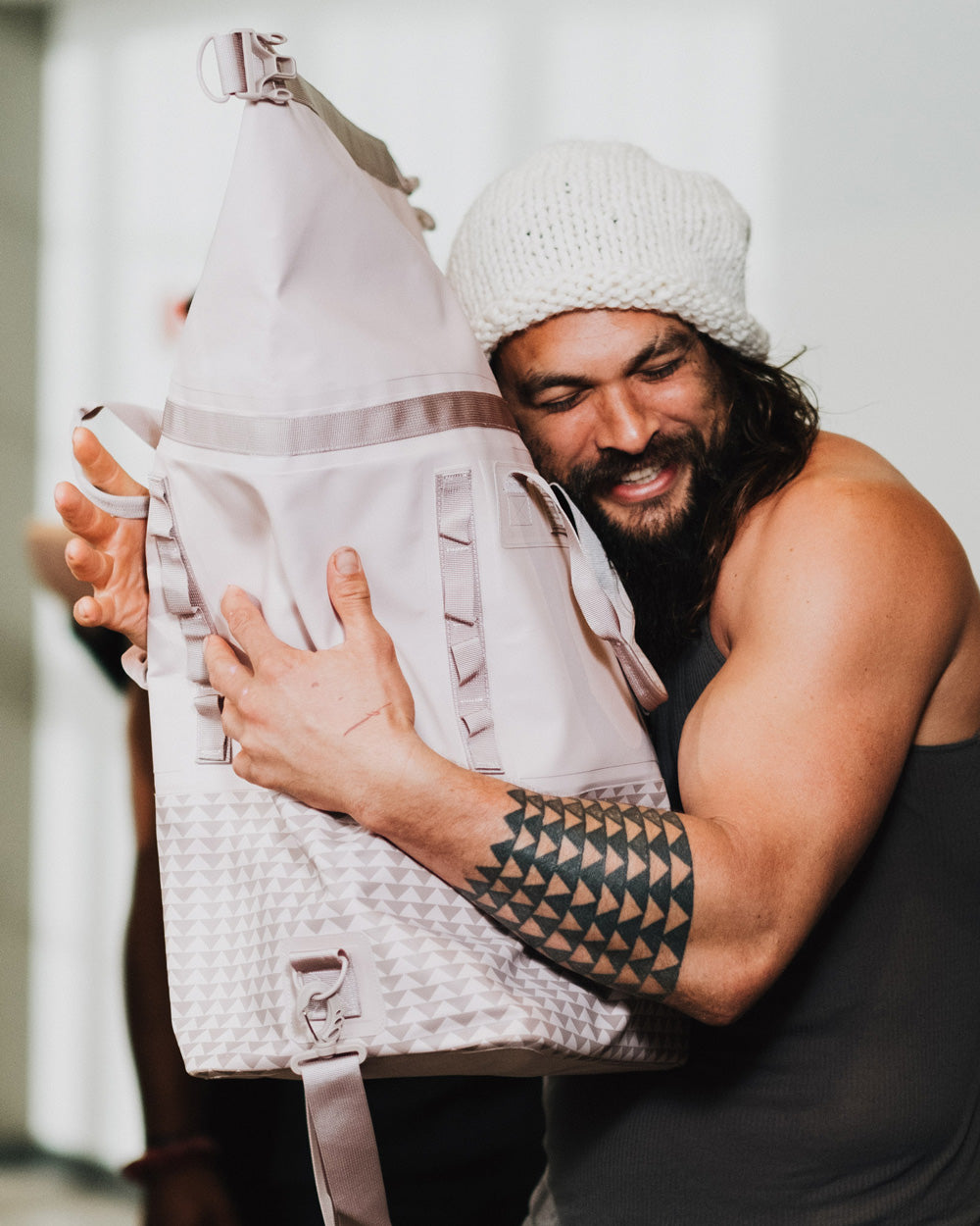 Jason Momoa hugs the pink So iLL Dirtbag