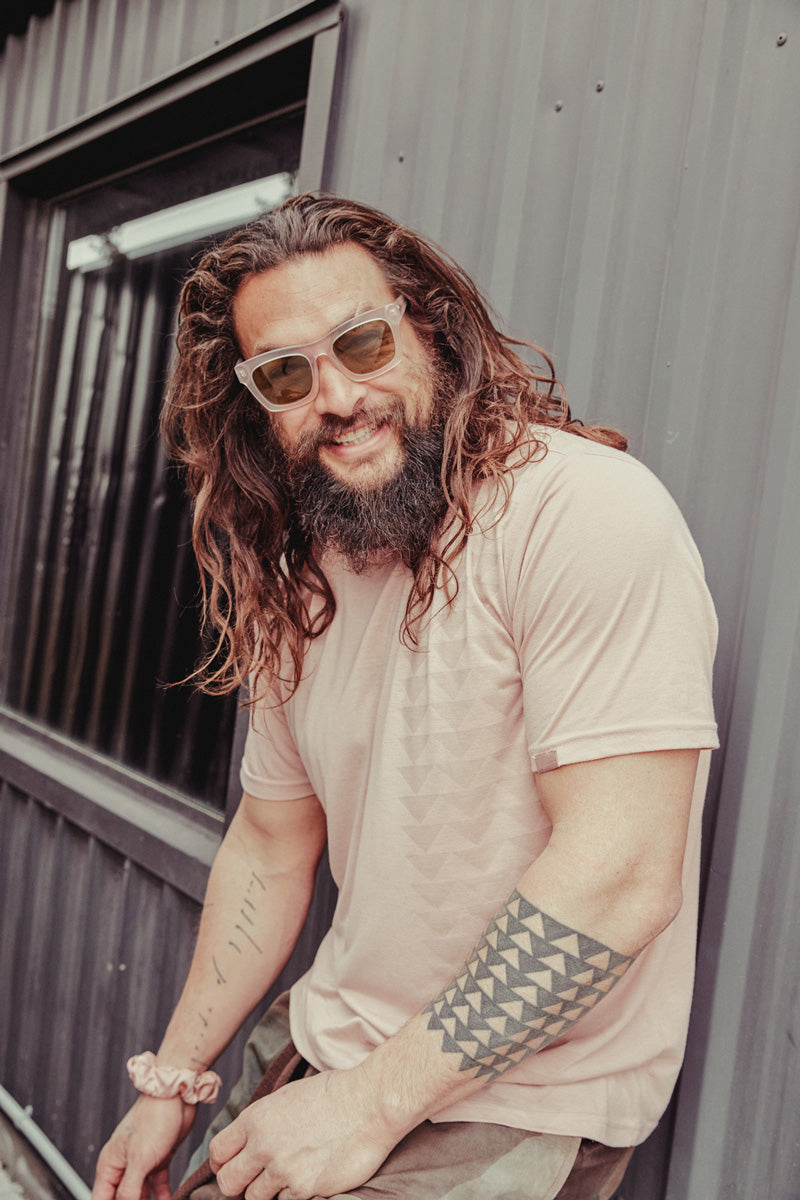 Jason Momoa hanging out in the so ill x on the roam nakoa dirty pink tee shirt