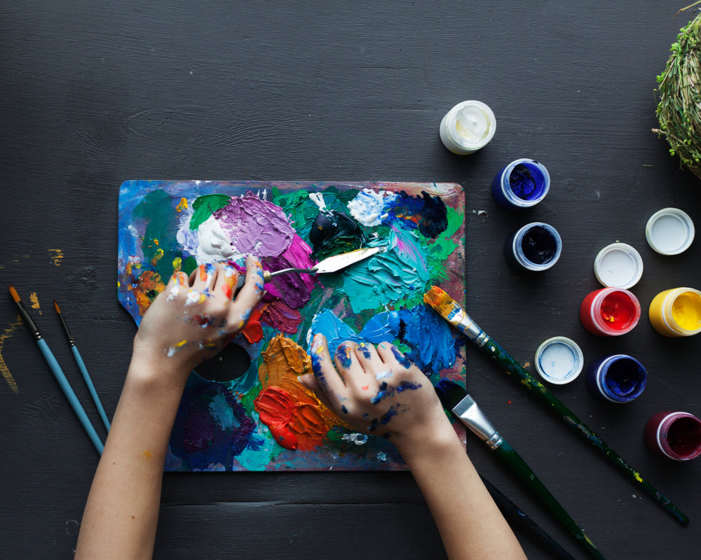 Artist Mixing Up Different Acrylic Paints