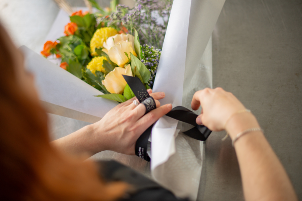 florist wrapping flowers