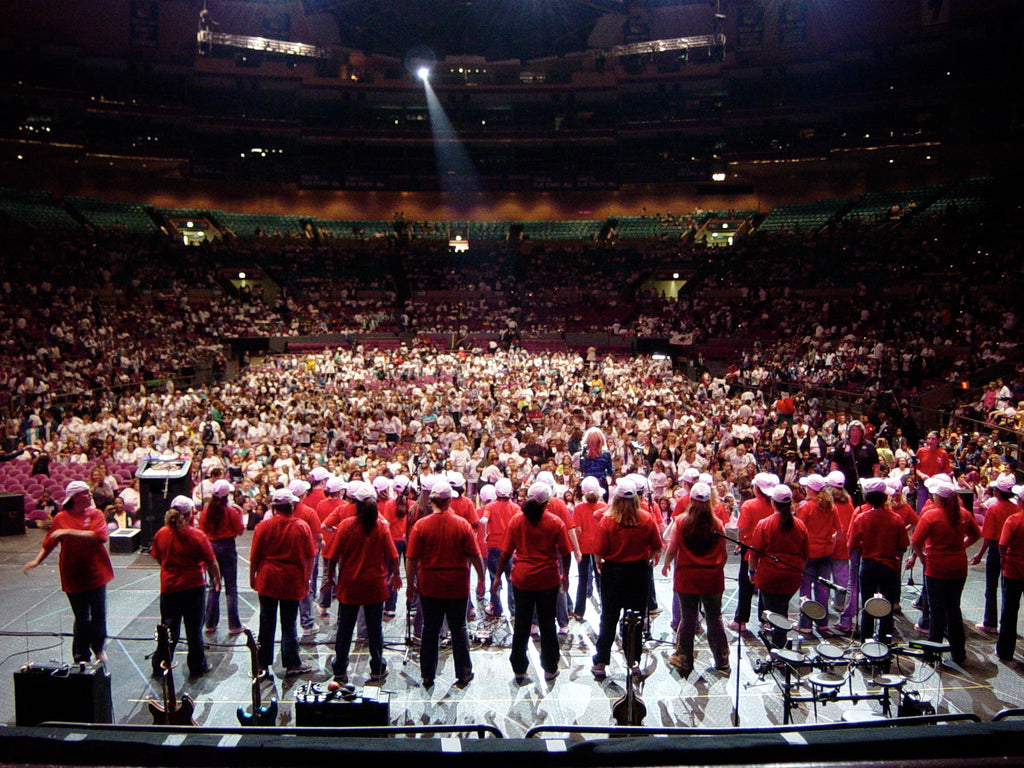 Melinda leading a 200 girl choir performance to a sold-out audience at Madison Square Gardens 2002