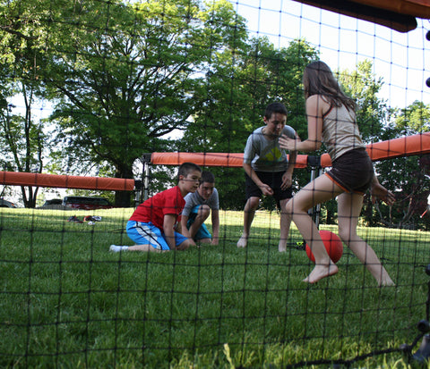 Watching a game of GaGa Ball through the durable netted wall panels.