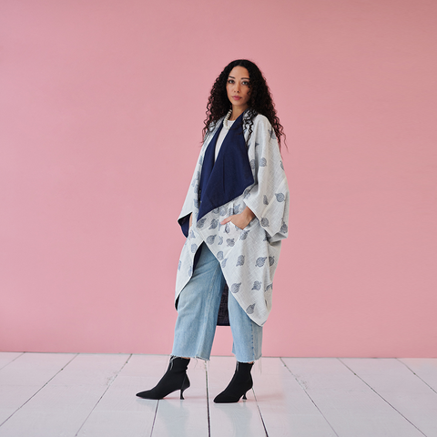 woman wearing blockprint kimono and jeans with high heeled boots