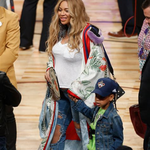 Beyonce with kimono and distressed jeans 