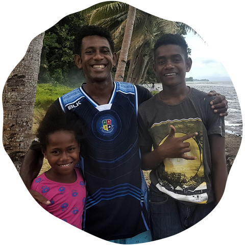 Sikeli mushroom and honey farmer in Suva, Fiji, with his family.