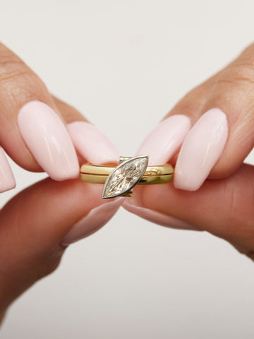 Model holding Marla Aaron's DiMe Siempre ring